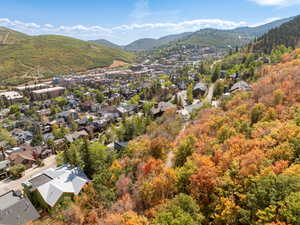 Aerial perspective of suburban area featuring a mountainous background