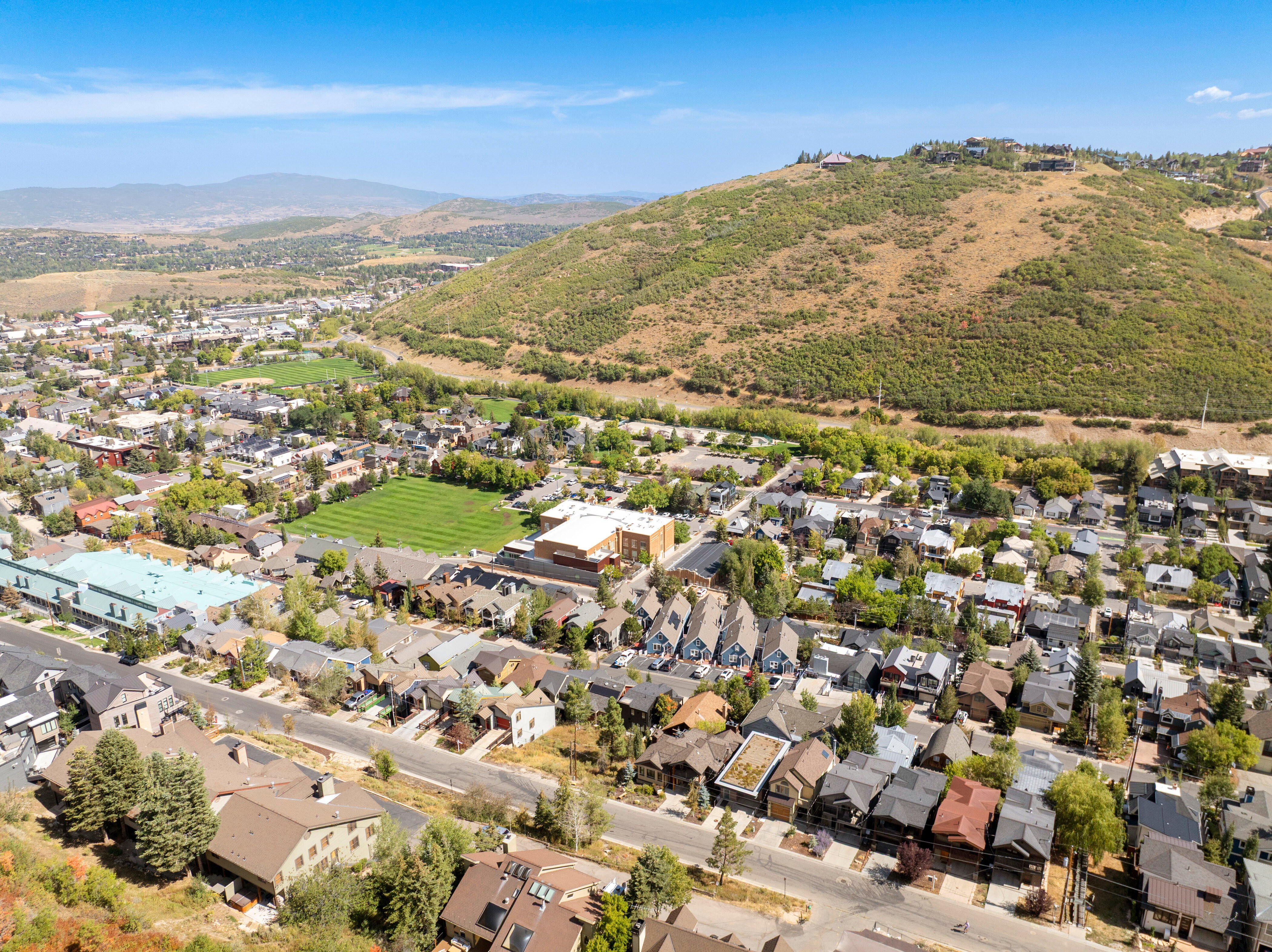 View of property location with nearby suburban area and mountains