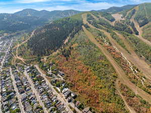 Aerial overview of property's location with a mountainous background