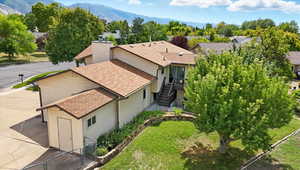 Aerial view of residential area featuring a mountain backdrop
