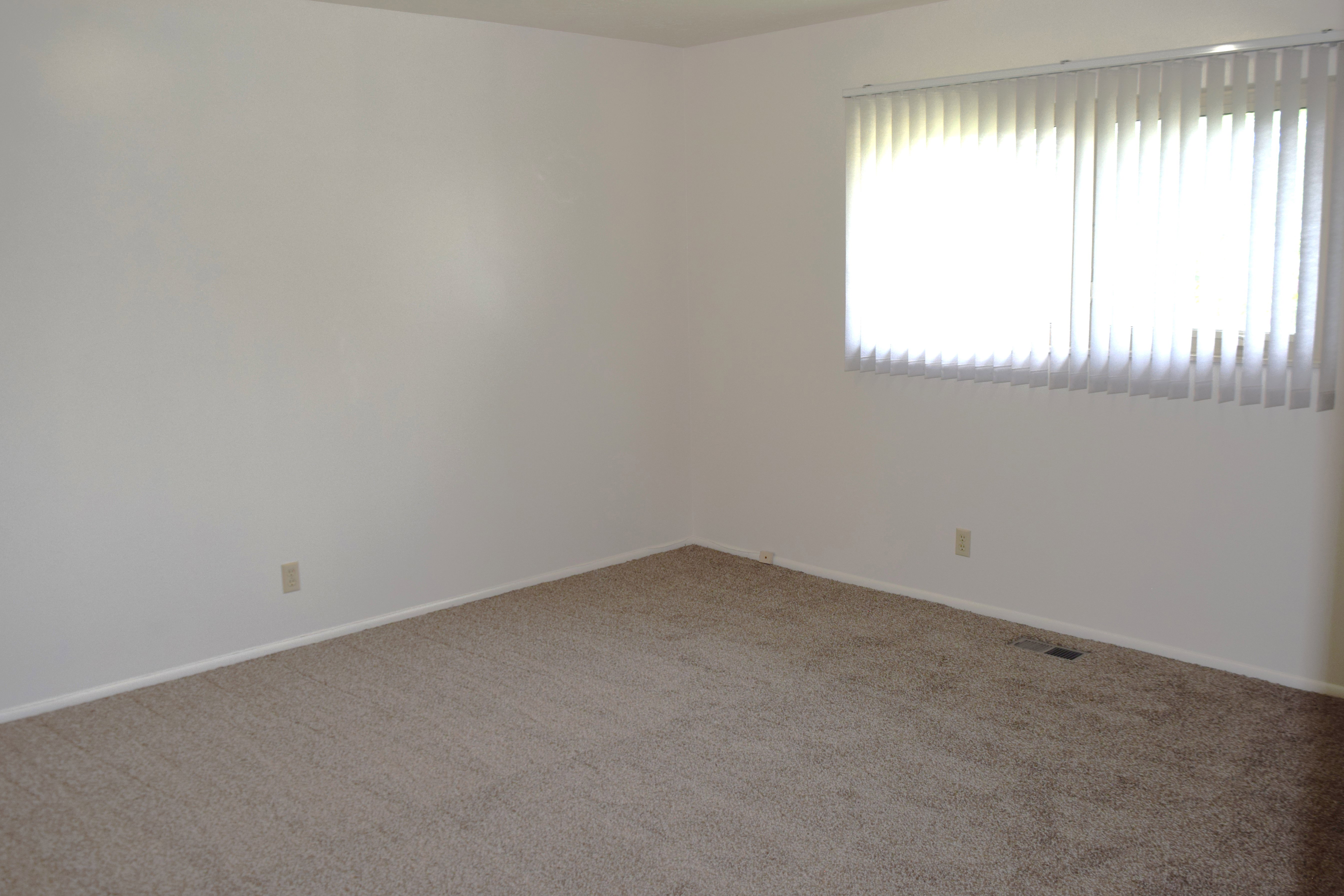 Unfurnished room featuring carpet flooring and baseboards