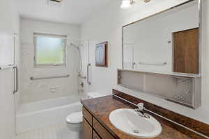 Full bathroom featuring shower / bath combination and vanity