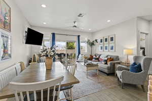 Dining space with a ceiling fan, tile floors, and recessed lighting