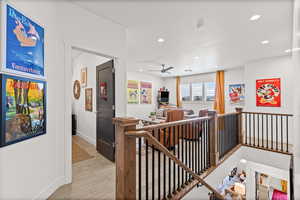 Stairs with tile floors, recessed lighting, and ceiling fan
