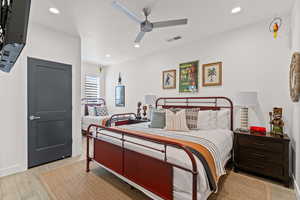 Bedroom featuring recessed lighting, ceiling fan, and light tile floors
