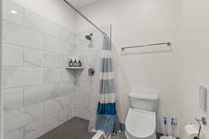 Full bathroom featuring a stall shower