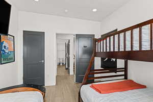 Bedroom featuring recessed lighting and light tile flooring