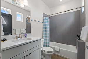 Full bath with shower / tub combo and vanity