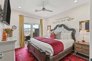 Bedroom with access to exterior, recessed lighting, and a ceiling fan