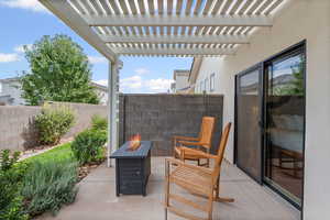 Backyard featuring a fire pit, a patio area, and a pergola