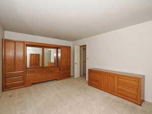 Bedroom features large walk in closet with organizers.