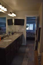 Ensuite bathroom featuring double vanity and granite countertop. Lots of cabinet space.