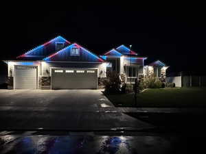 Evening view of home with Trimlights turned on