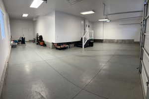 View of 4 car garage. Motion sensor lights installed