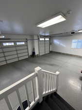 View of 4 car garage. Motion sensor lights installed