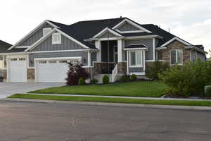 Craftsman house with stone, board and stucco siding