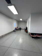 View of 4 car garage. Motion sensor lights installed