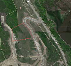 Aerial overview of property's location with property parcel outlined
