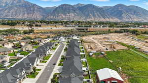 Aerial perspective of suburban area featuring a mountainous background