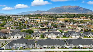 Aerial perspective of suburban area featuring a mountainous background