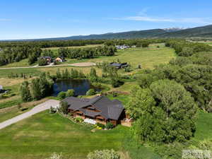 Aerial view of sparsely populated area featuring a water and mountain view