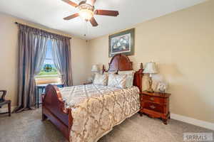 Bedroom featuring carpet flooring and a ceiling fan