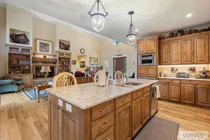 Kitchen featuring brown cabinets and light wood finished floors
