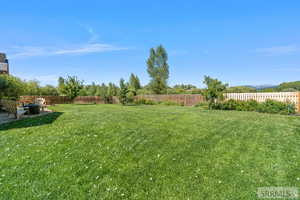 View of fenced backyard