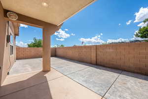 Fenced backyard featuring a patio area