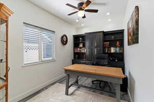 Office featuring ceiling fan, light wood-style flooring, and recessed lighting
