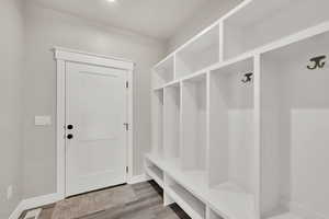 Mudroom featuring wood finished floors