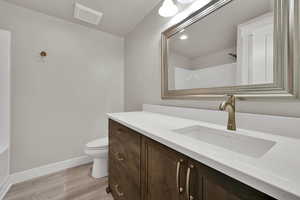 Bathroom featuring vanity, light wood-style flooring, and recessed lighting