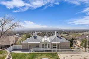 Aerial view of property and surrounding area with mountains