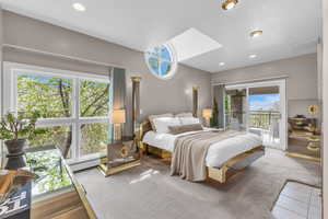 Bedroom with carpet flooring, multiple windows, access to exterior, and recessed lighting