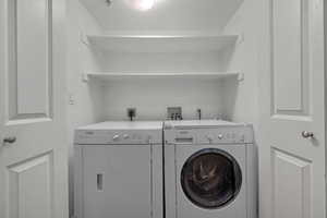 Washroom featuring independent washer and dryer
