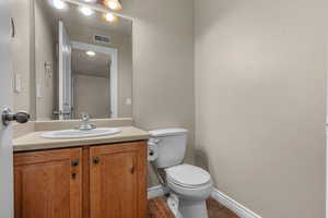 Half bath with vanity and toilet