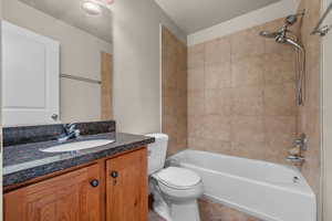 Full bath featuring shower / washtub combination and vanity