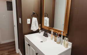 Bathroom featuring vanity, laminate flooring