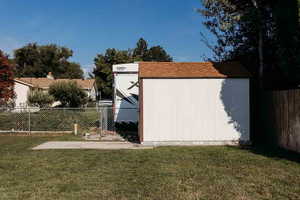 View of shed and fenced y