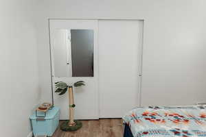 Bedroom 2 featuring laminate floors