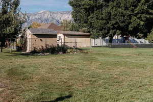 View of fenced yard featuring amazing mountain views