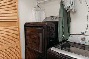 Laundry area with washing machine and clothes dryer