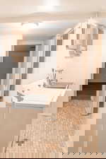 Laundry area featuring baseboards