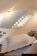 Bedroom with carpet flooring and vaulted ceiling