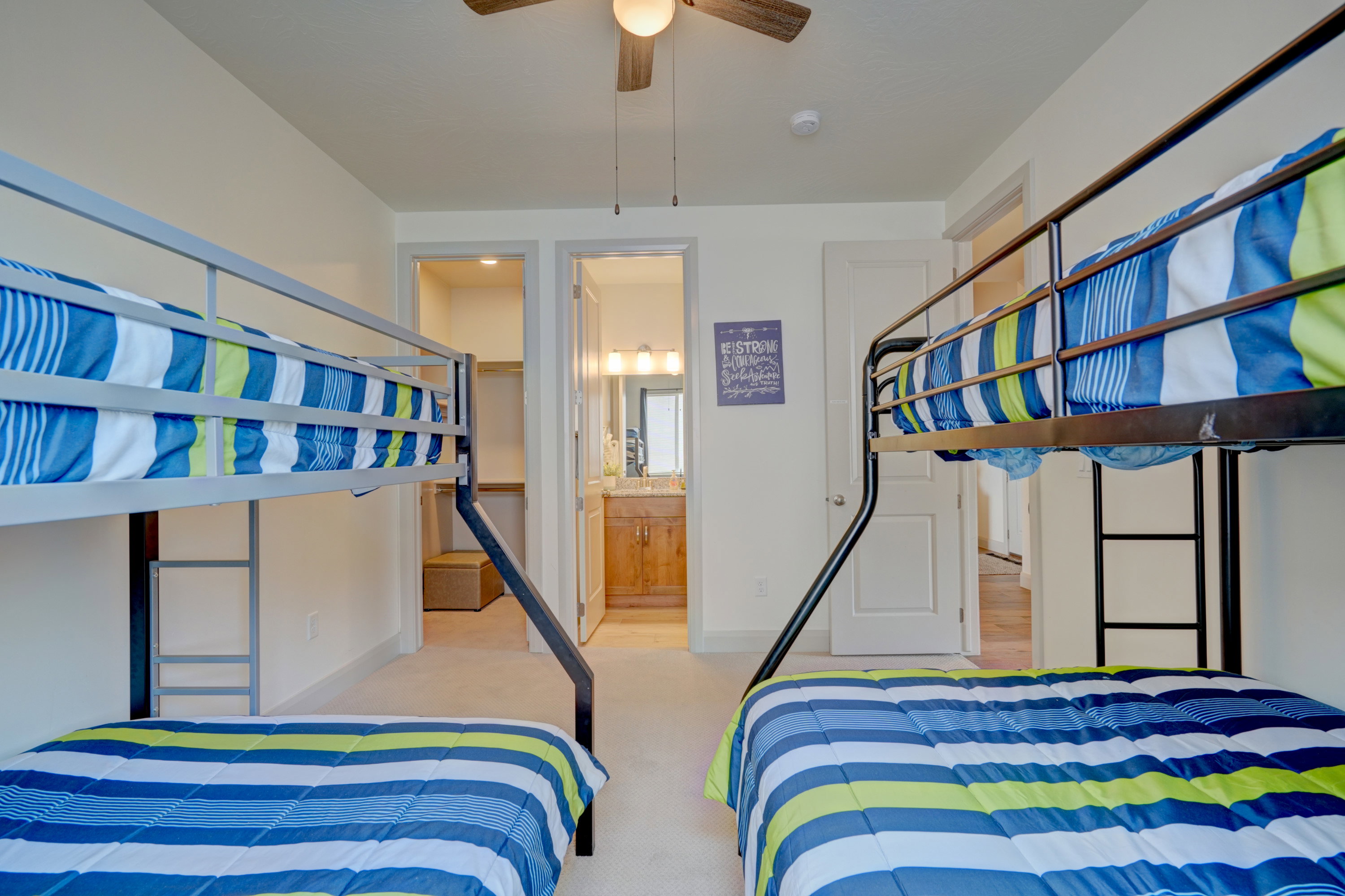 Bedroom featuring light colored carpet and ceiling fan