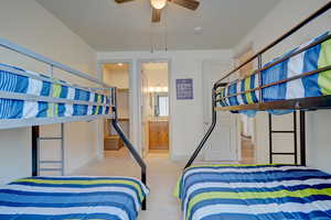 Bedroom featuring light colored carpet and ceiling fan