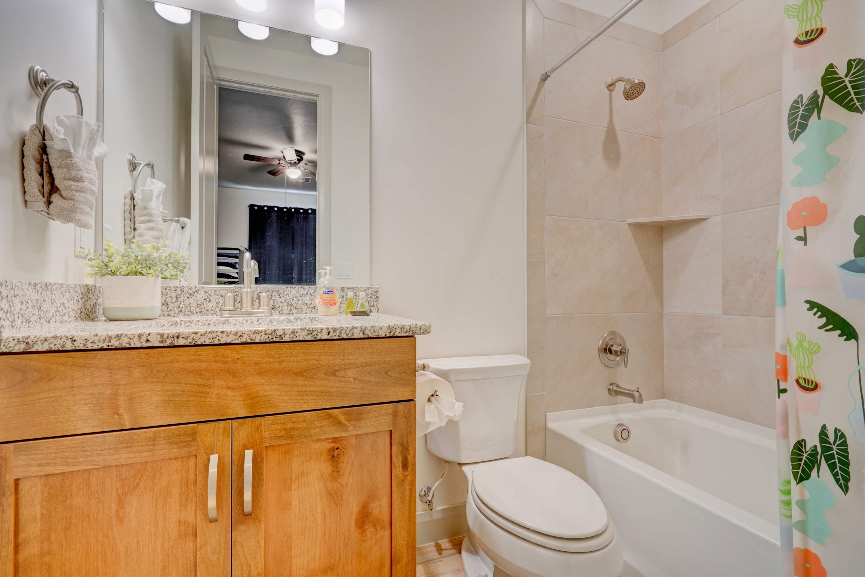 Full bath with shower / bath combo and vanity