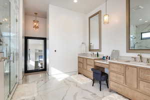 Full bathroom with light marble finish flooring, a marble finish shower, vanity, and recessed lighting