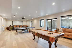 Recreation room featuring light wood-type flooring, billiards, and recessed lighting