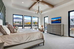 Bedroom featuring access to exterior, carpet, beam ceiling, recessed lighting, and a chandelier